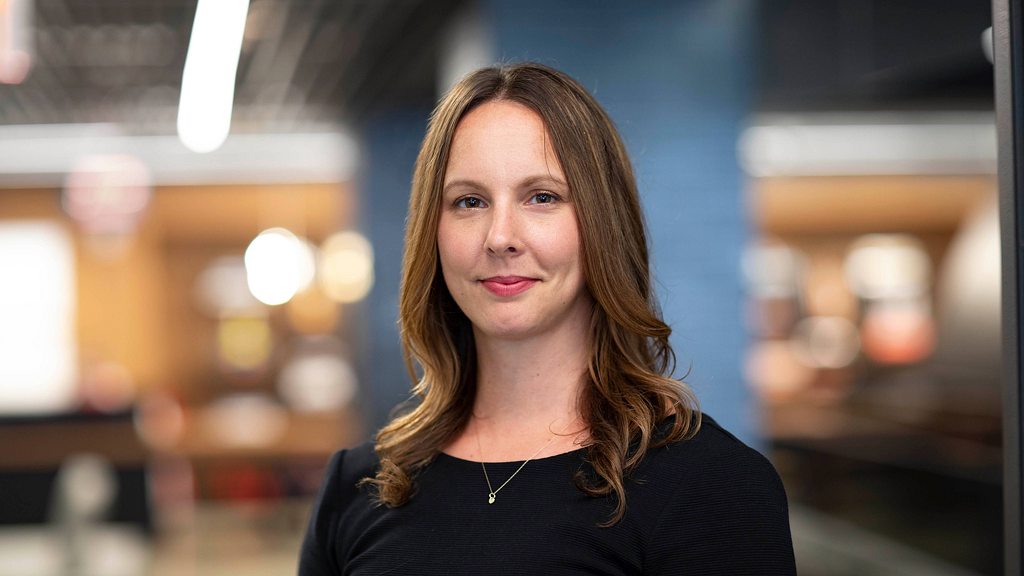 A woman with long brown hair.